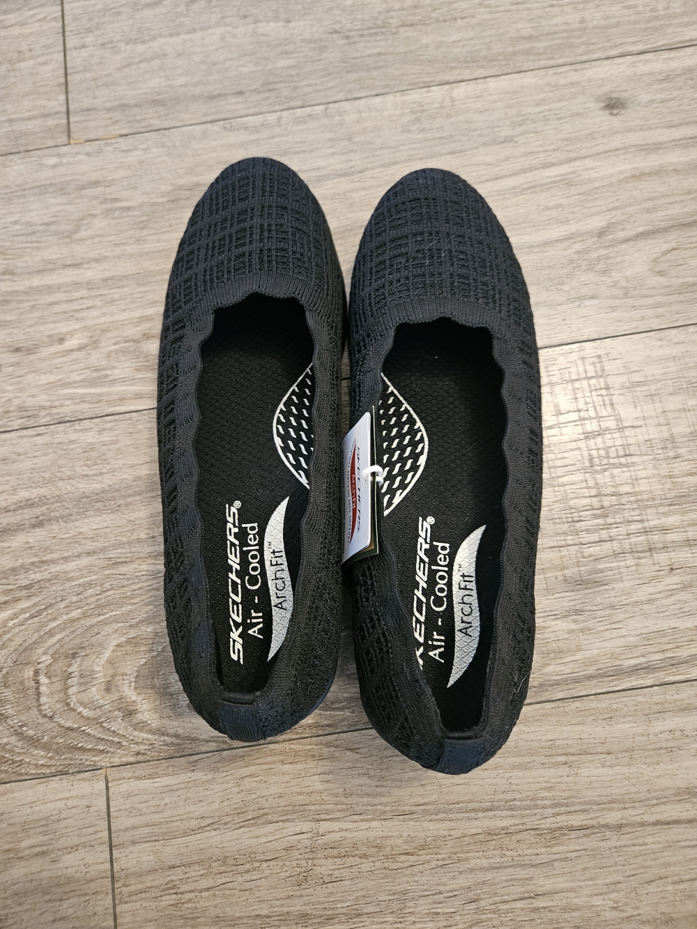 Skechers Women’s Black Knit Slip-On Flats with Arch Fit